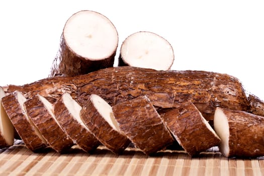 Close up view of the cassava root isolated on a white background.
