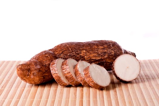 Close up view of the cassava root isolated on a white background.