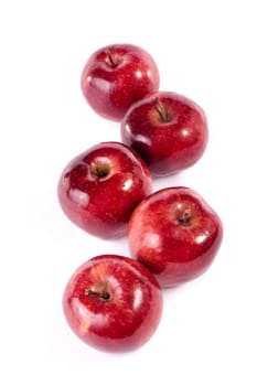 Close up view of some red apples isolated on a white background.