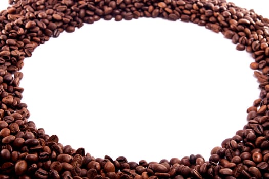 Close up view of a bunch of roasted beans of coffee.