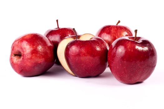 Close up view of some red apples isolated on a white background.