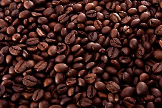 Close up view of a bunch of roasted beans of coffee.