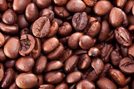 Close up view of a bunch of roasted beans of coffee.