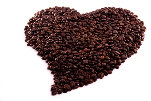 Close up view of a bunch of roasted beans of coffee.