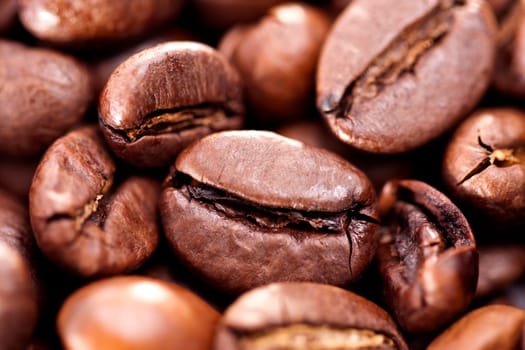 Close up view of a bunch of roasted beans of coffee.