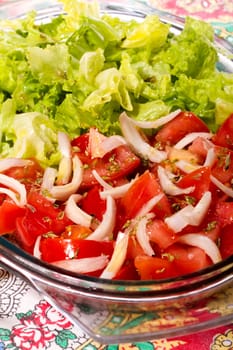 Close up view of the typical Mediterranean Portuguese salad with tomato and lettuce.