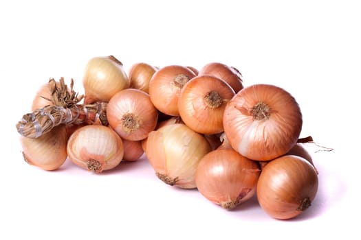 Close up view of a bunch of onions isolated on a white background.