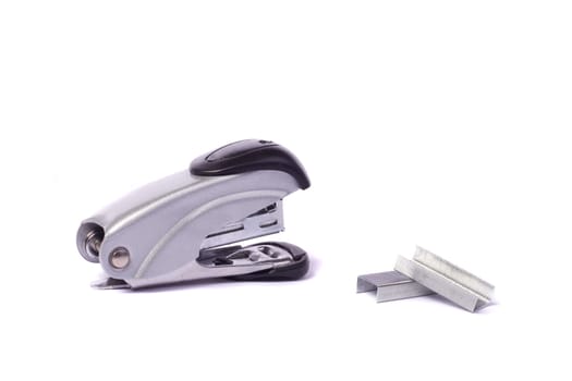Close up view of a office stapler isolated on a white background.