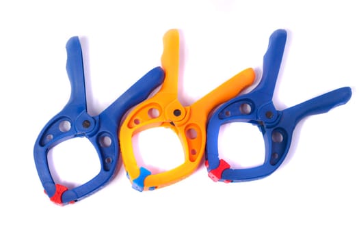Close up view of some clamps isolated on a white background.