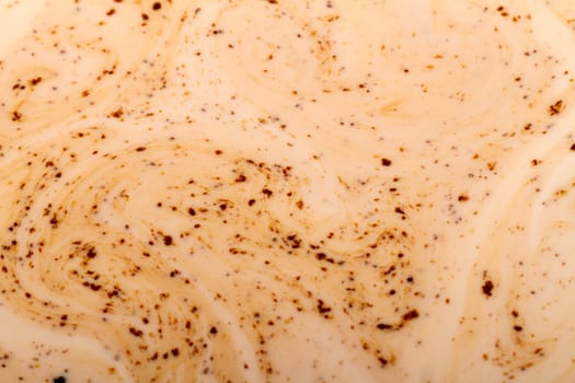 Close up view detail of the texture of coffee mixed with milk.