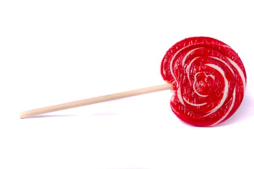Close up view of a sweet lollipop isolated on a white background.