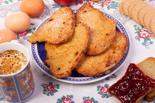 Close up view detail of several golden slices of bread sprinkled with sugar.