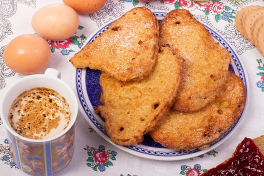 Close up view detail of several golden slices of bread sprinkled with sugar.