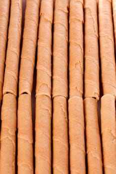 Close up view of a bunch of cookie sticks isolated on a white background.