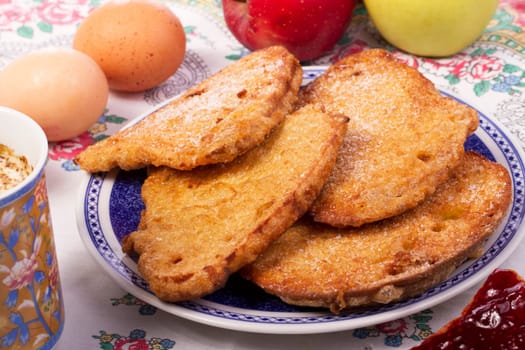 Close up view detail of several golden slices of bread sprinkled with sugar.