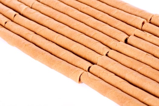 Close up view of a bunch of cookie sticks isolated on a white background.