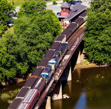 Aerial view over the National Park town of Harpers Ferry in West Virginia with railway station and freight trains