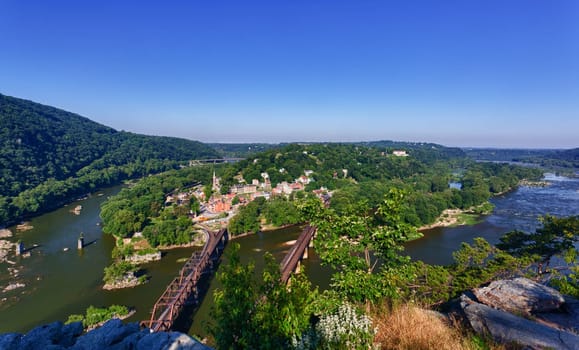 View over historical civil war town of Harpers Ferry, a National Park owned town, by the confluence of the Potomac and Shenandoah rivers