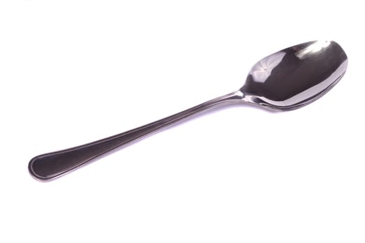 Close up view detail of a spoon isolated on a white background.