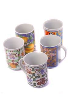 Close up view detail of some breakfast mugs isolated on a white background.