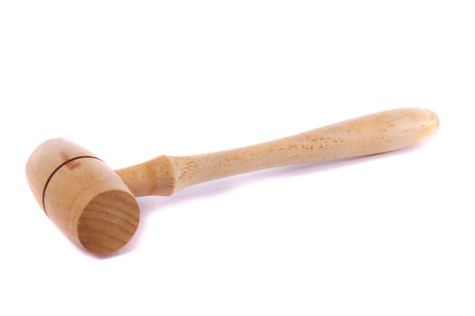 Close view detail of a small wooden kitchen hammer isolated on a white background.