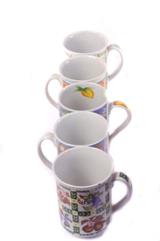 Close up view detail of some breakfast mugs isolated on a white background.