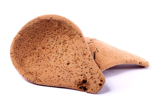 Close up view detail of a traditional handmade drinking utensil called "cocho"" carved from cork from the interior regions of Portugal."