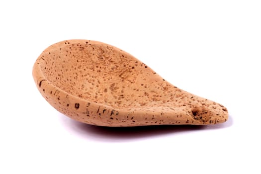 Close up view detail of a traditional handmade drinking utensil called "cocho"" carved from cork from the interior regions of Portugal."