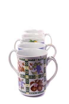 Close up view detail of some breakfast mugs isolated on a white background.