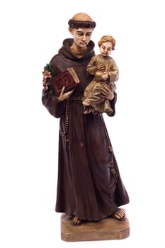 Close up view detail of a ceramic monk holding a child, isolated on a white background.