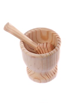 Close up view detail of a wooden garlic smasher isolated on a white background.