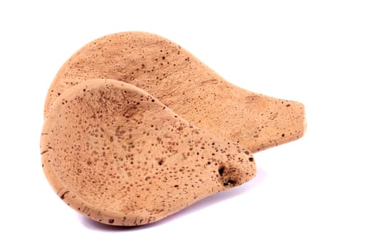 Close up view detail of a traditional handmade drinking utensil called "cocho"" carved from cork from the interior regions of Portugal."