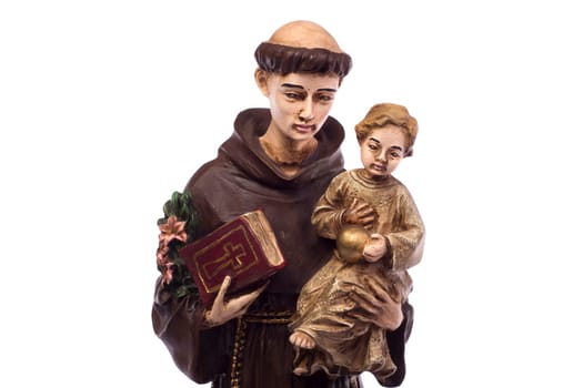Close up view detail of a ceramic monk holding a child, isolated on a white background.