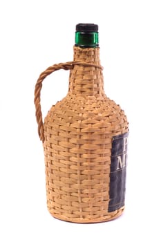 Close up view detail of a 5lt Portuguese wine bottle isolated on a white background.