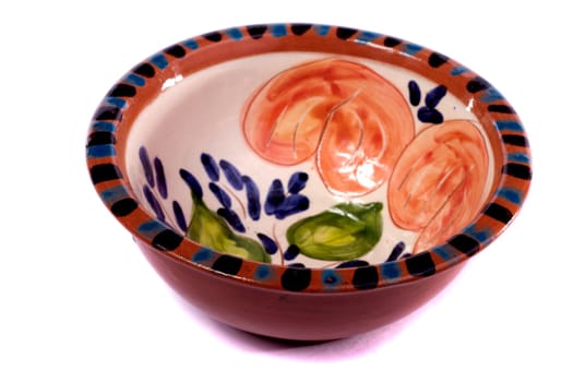 Close up view detail of a earthenware soup bowl isolated on a white background.
