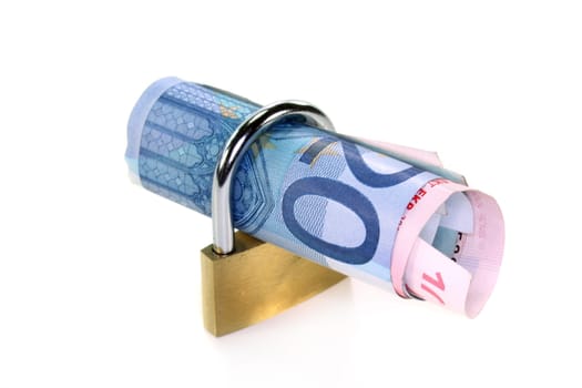 Padlock and money roll against white background