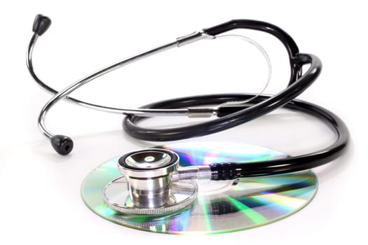 CD and stethoscope against white background