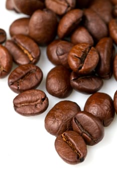 macro shot of coffee beans isolated on white background