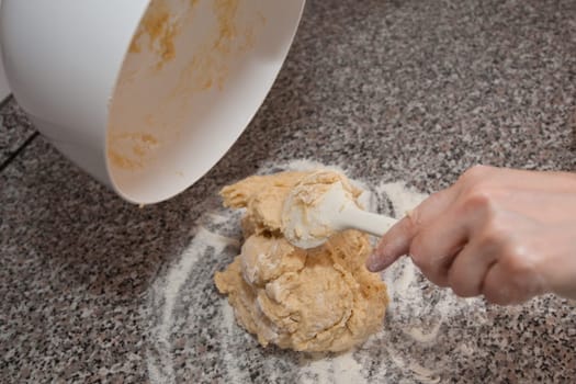 Stirred yeast dough and mixing spoon
