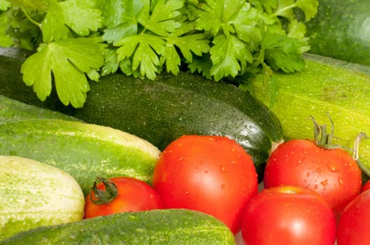 Close Up of Fresh Vegetables - Tomatoes, Cucumbers, Zucchinis and Parsley