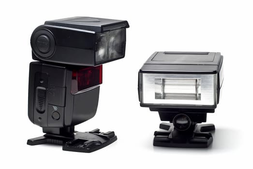 Two speedlight flashes isolated on a white background.