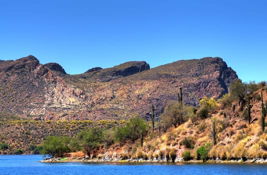 A large Arizona desert lake with clear blue sky
