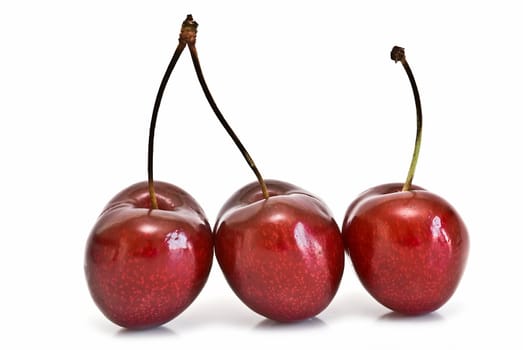 Fresh cherries isolated on a white background.