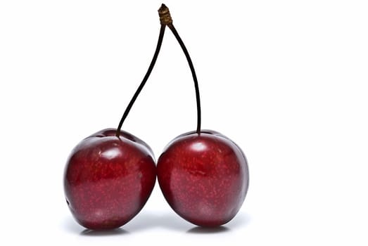 Fresh cherries isolated on a white background.