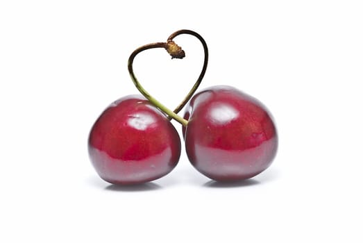 Fresh cherries isolated on a white background.