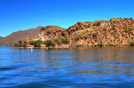 A large Arizona desert lake with clear blue sky