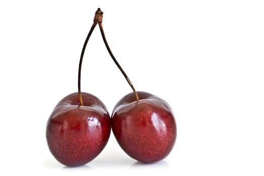 Fresh cherries isolated on a white background.