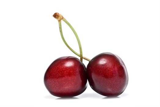 Fresh cherries isolated on a white background.
