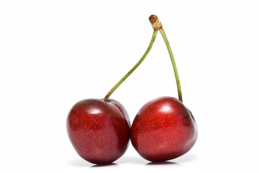 Fresh cherries isolated on a white background.