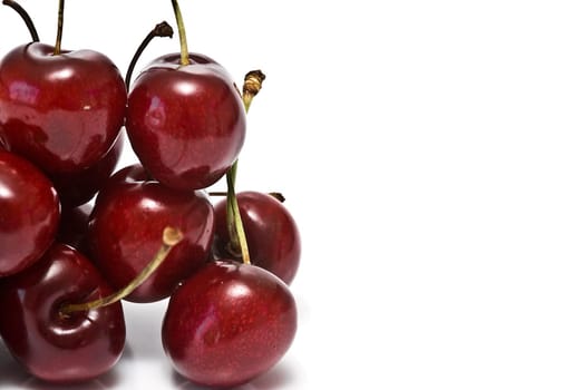 Fresh cherries isolated on a white background.
